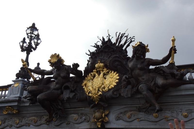 Ornate Bronze Sculpture on Building Facade