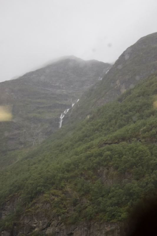 Mist-Shrouded Mountains With Waterfall