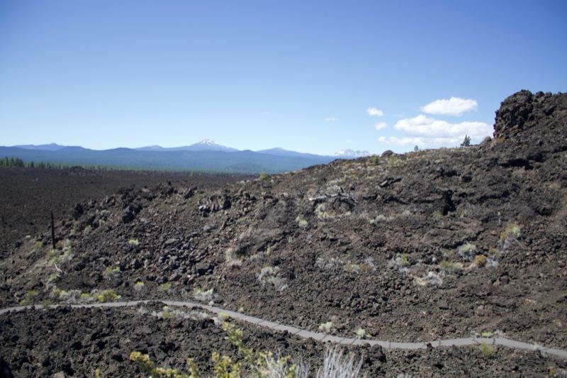 Volcanic Trail With Distant Mountain