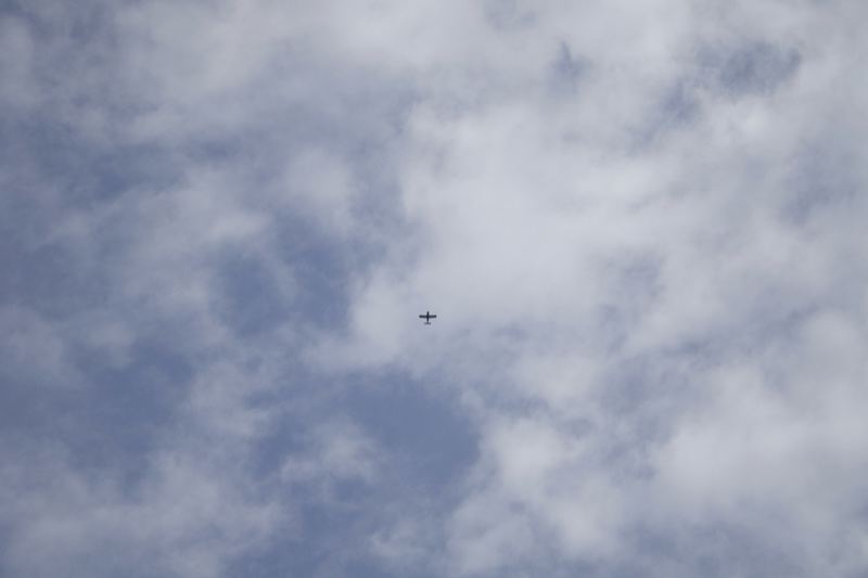 Aircraft Flying Through Cloudy Sky