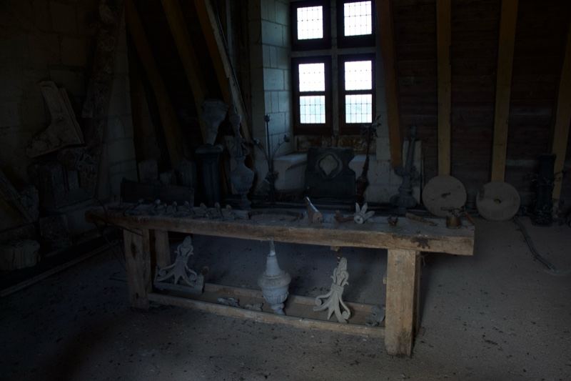 Medieval workshop interior with sculptures