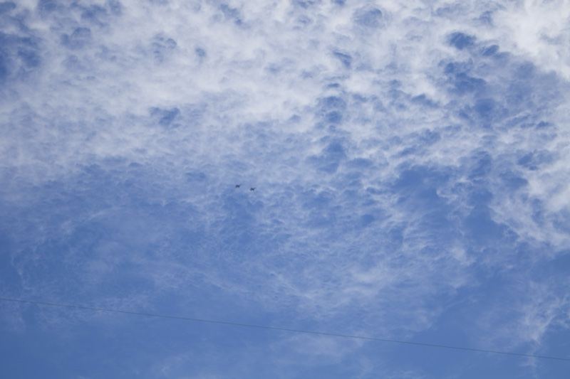 Wispy Clouds Over Blue Sky