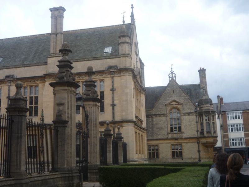 Historic college building with gate