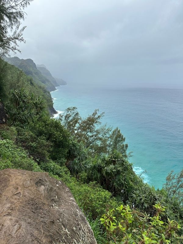 Misty Coastal Cliffs Over Turquoise Sea