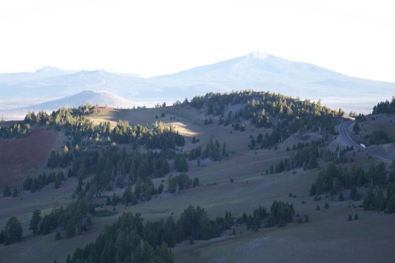 Mountain Range Over Forested Plateau