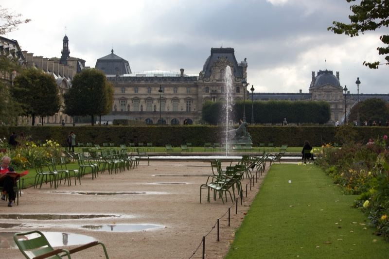 Louvre Courtyard with Fountain and Chairs