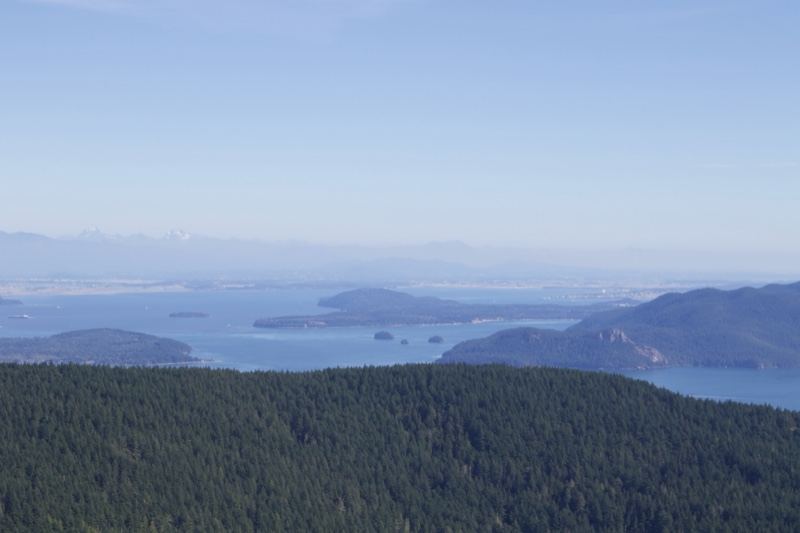 Aerial View of Forested Hills Over Islands