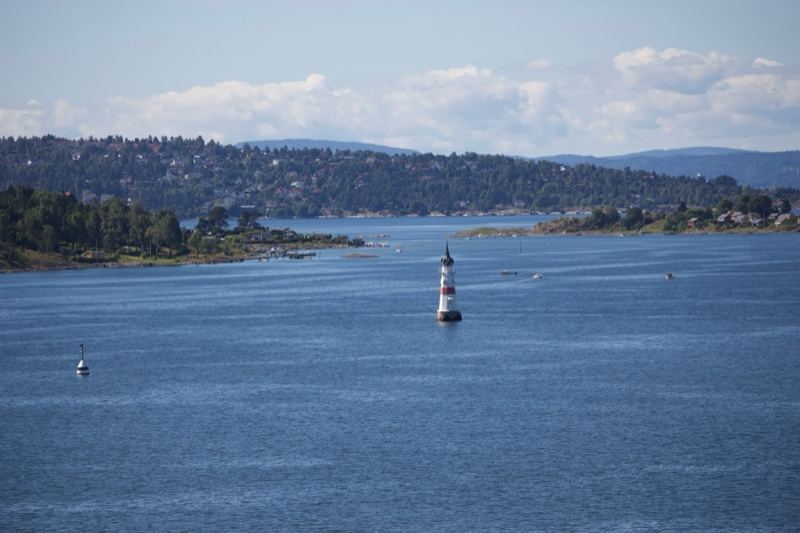 Lighthouse on Distant Waterway