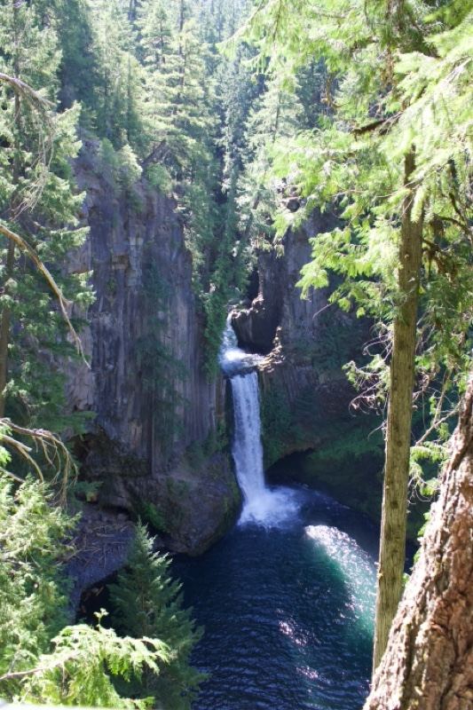 Waterfall Cascading Into Deep Gorge Pool