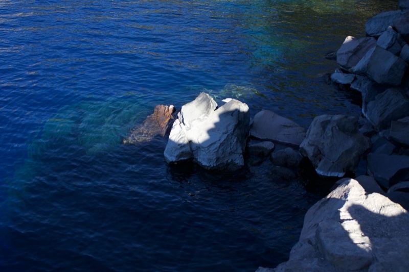 Deep Blue Lake With Rocky Shoreline