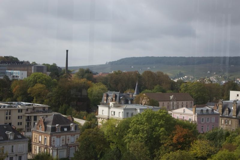 Overlook of city with trees and hills