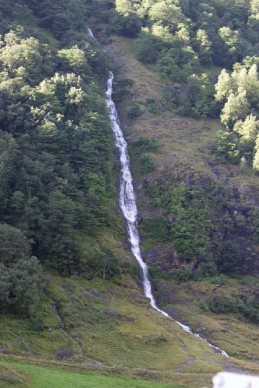 Mountain Waterfall Cascading Down Hillside