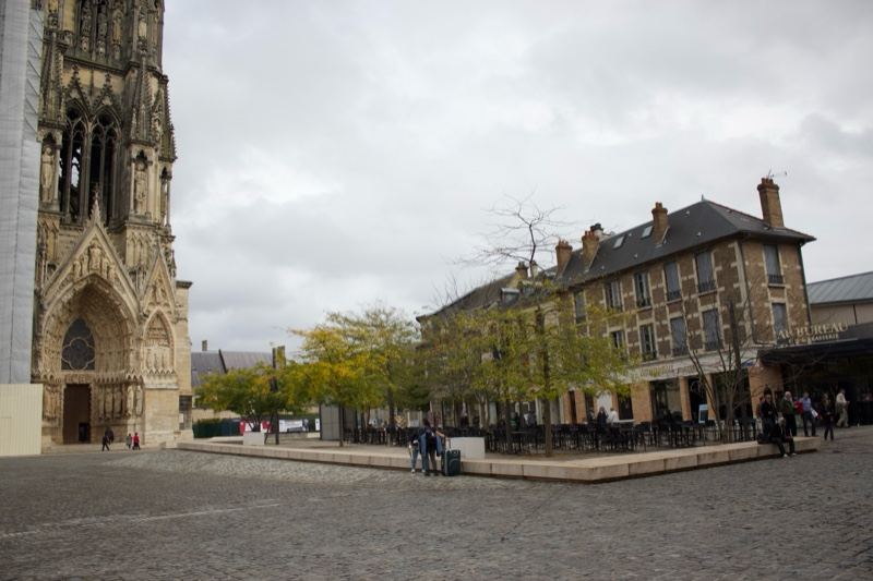 Gothic tower in cobblestone square