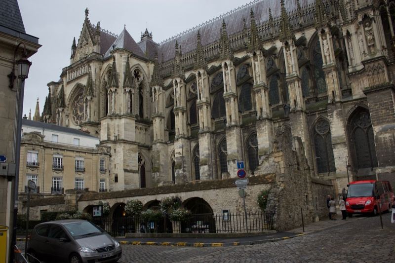 Gothic Cathedral Facade On Cobblestone Street