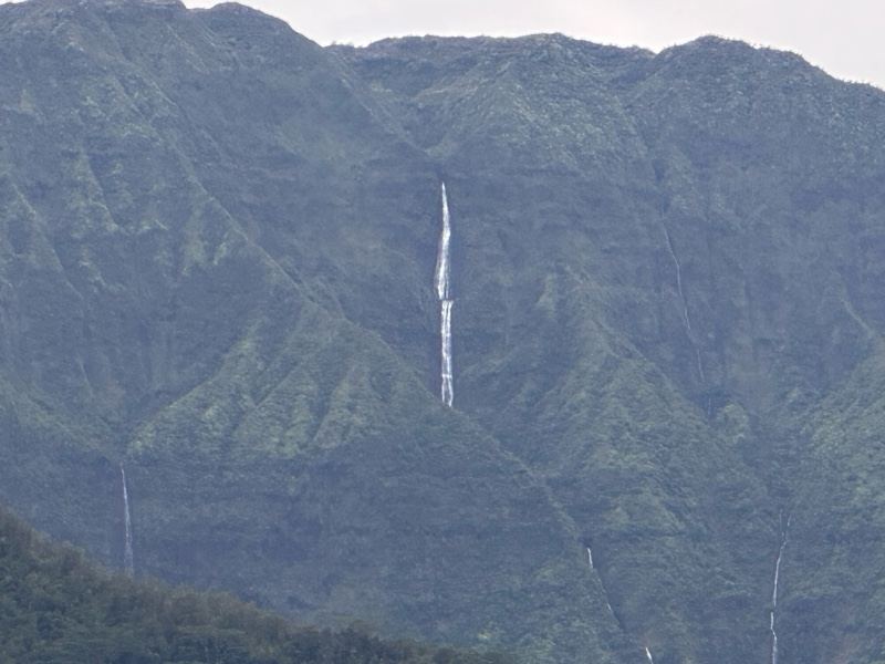 Waterfalls on Lush Mountain Cliff