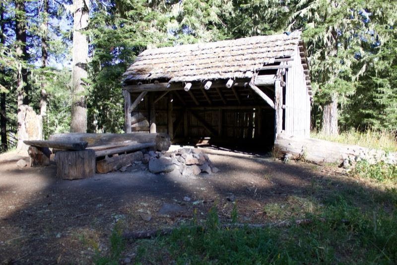 Rustic Wooden Shelter In Forest