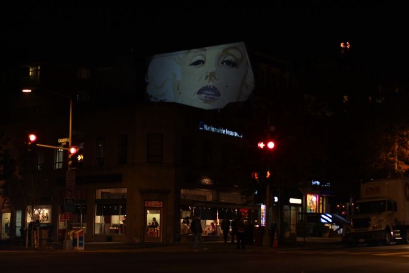 Projected Face on Building at Night