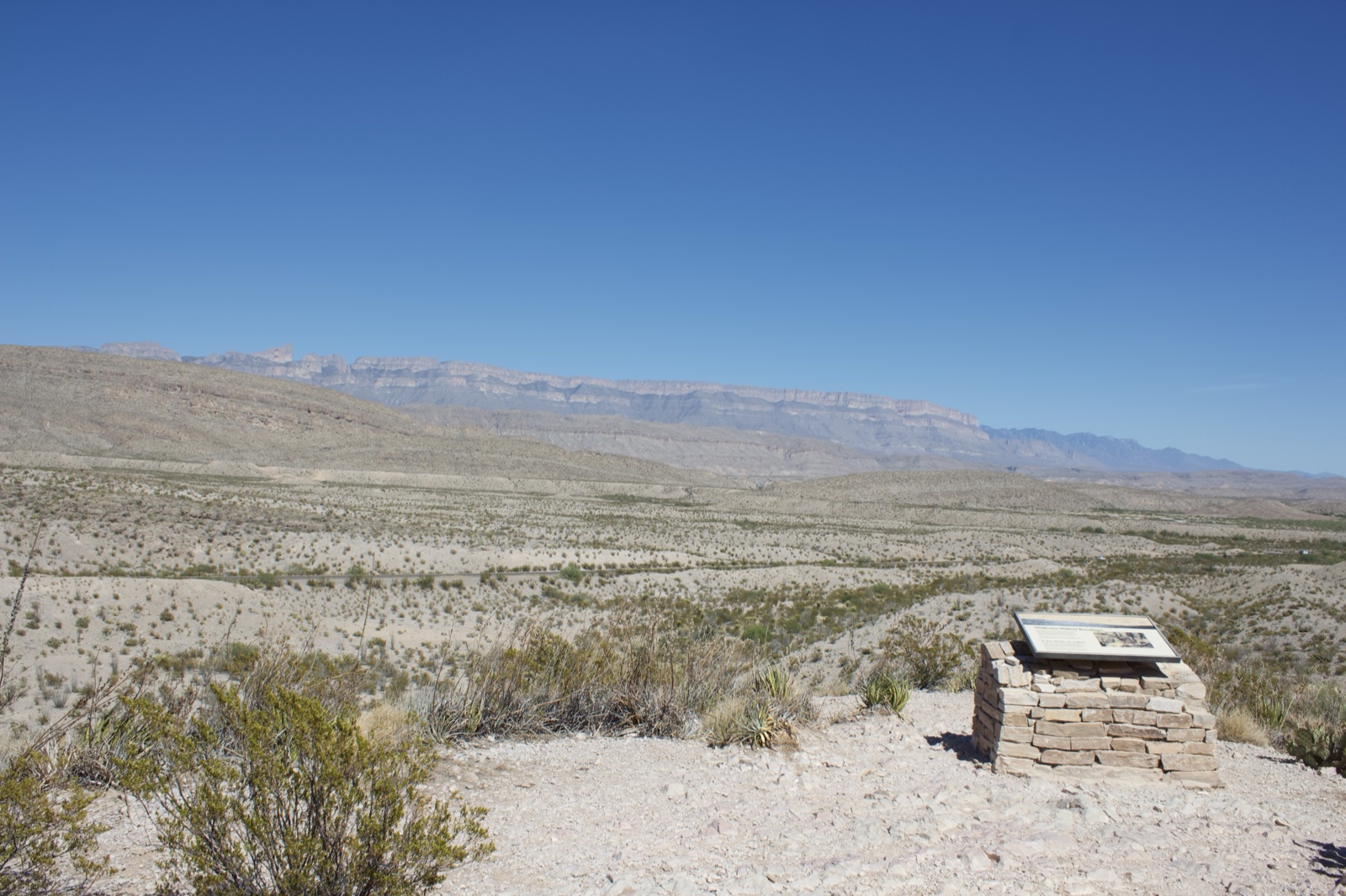 Desert landscape with stone marker