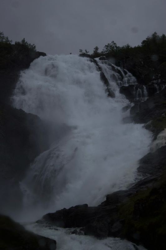 Powerful waterfall cascading down cliff