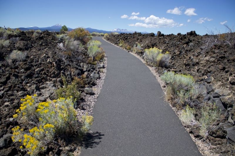 Paved Trail Through Volcanic Landscape