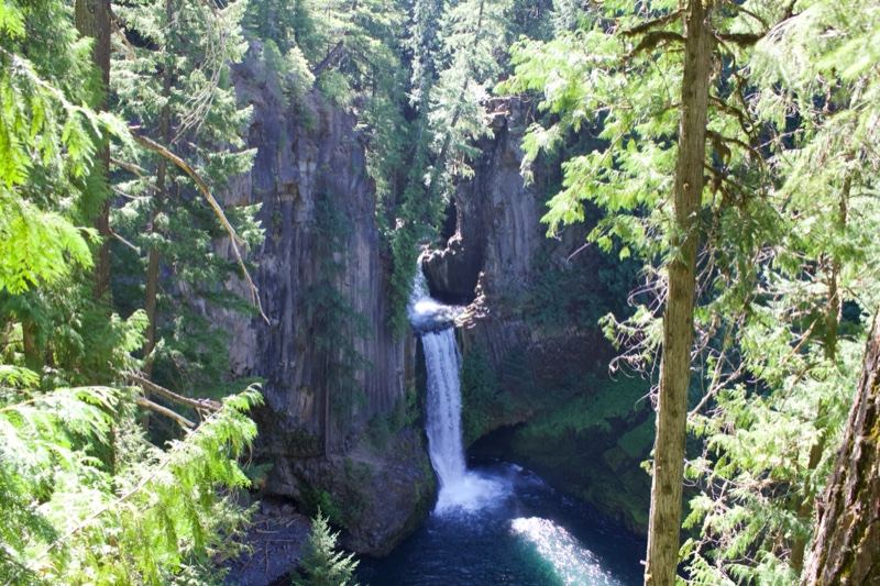 Waterfall Cascading Into Forest Pool