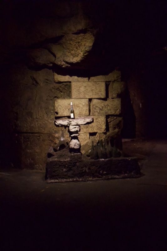 Illuminated totem in stone chamber