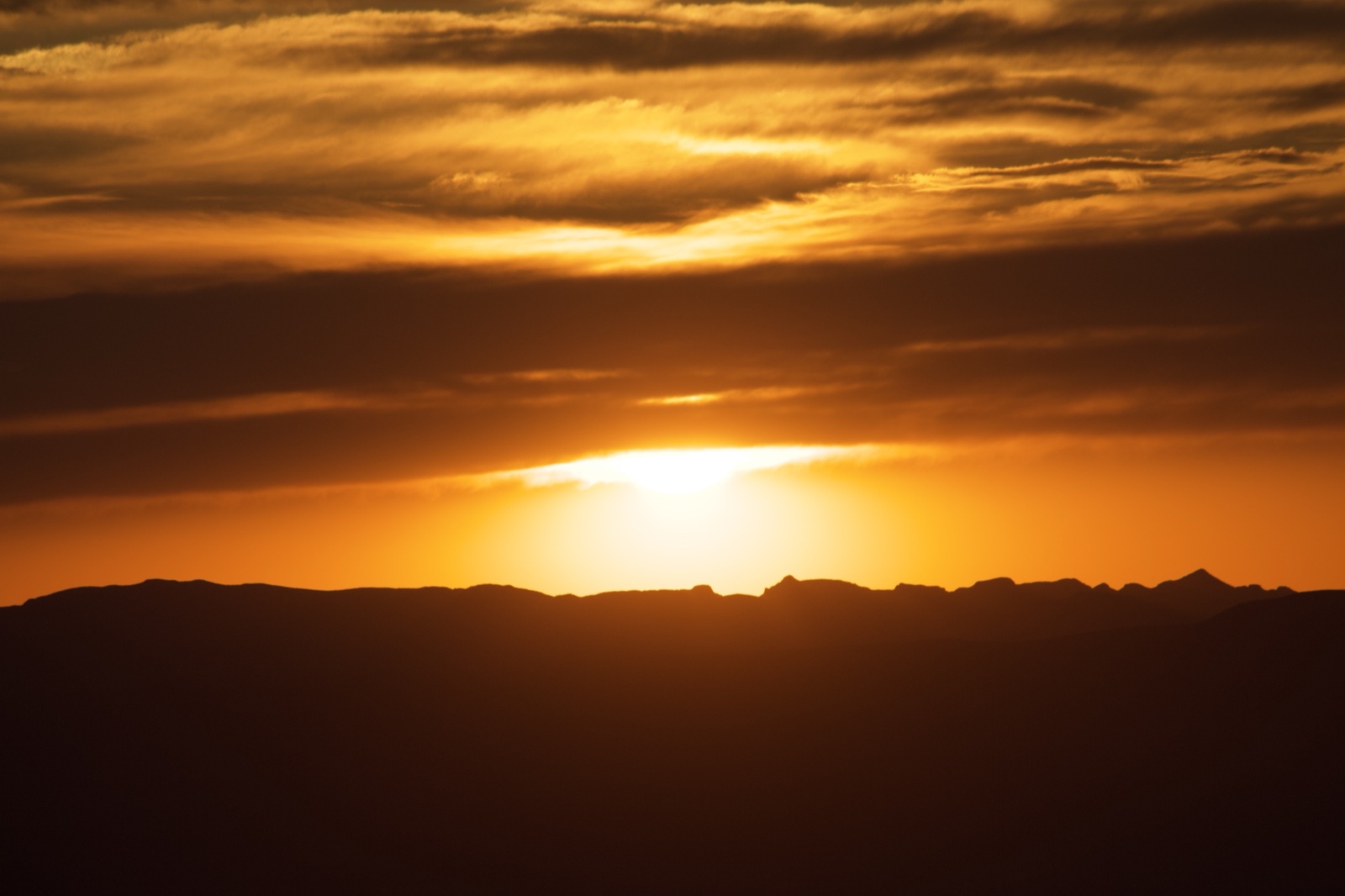 Sunset Over Mountain Silhouette