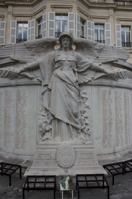 Winged Angel Monument on Building Facade