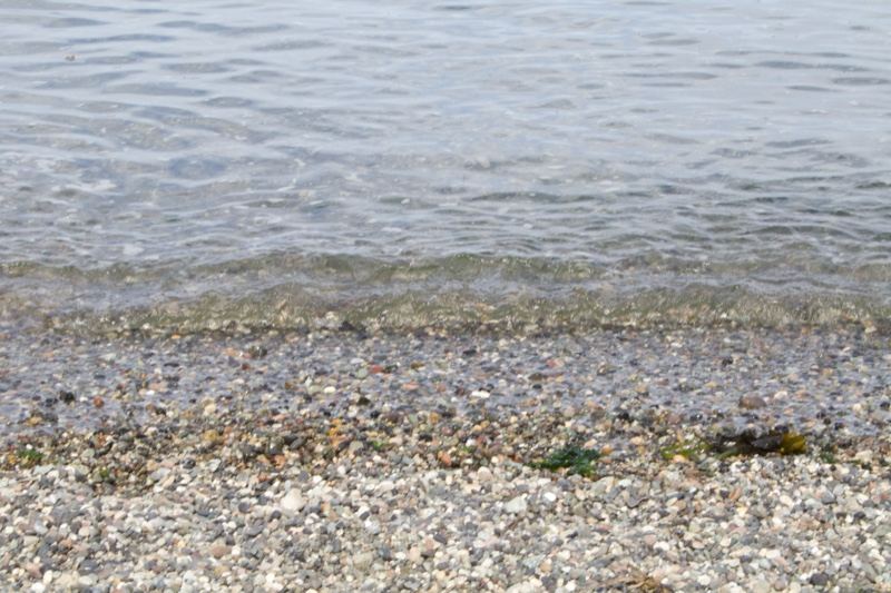Pebble Shore Meeting Calm Water