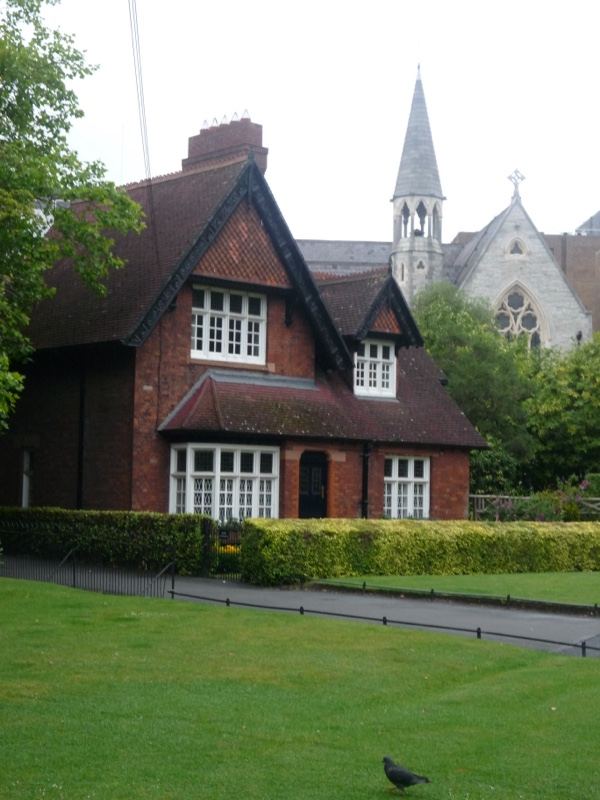 Red brick cottage with church spire