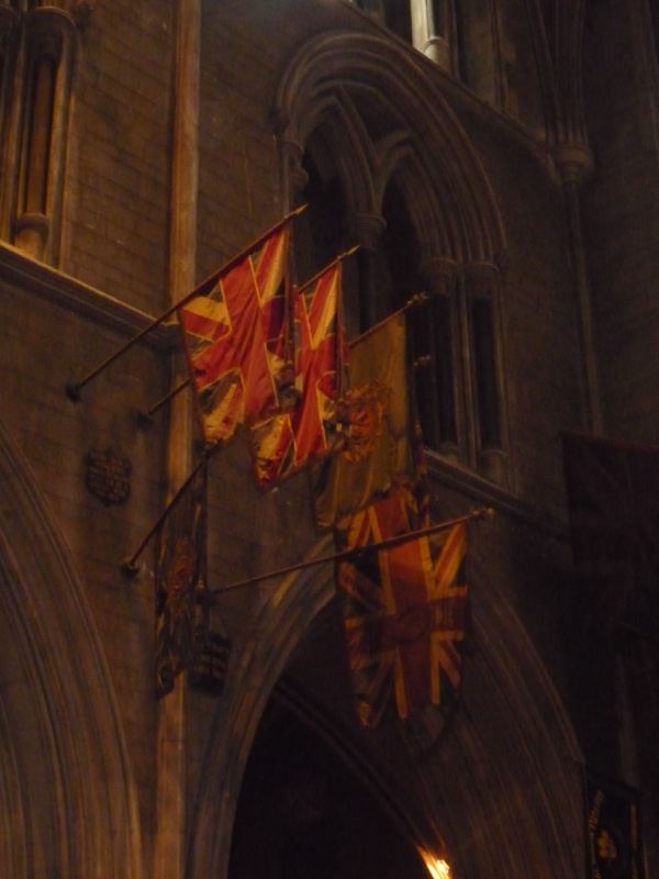 Flags Hanging in Gothic Cathedral Interior