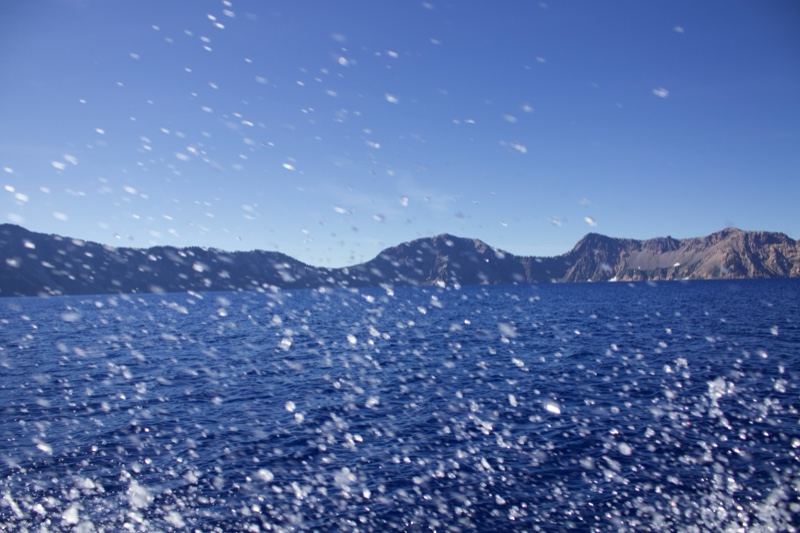 Sea Splashes With Distant Mountains