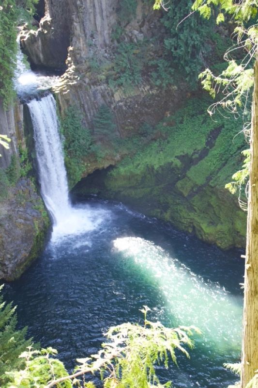 Waterfall Cascading Into Deep Pool