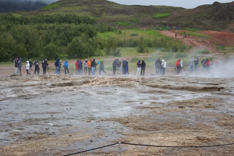 Tourists Watching Geyser Eruption