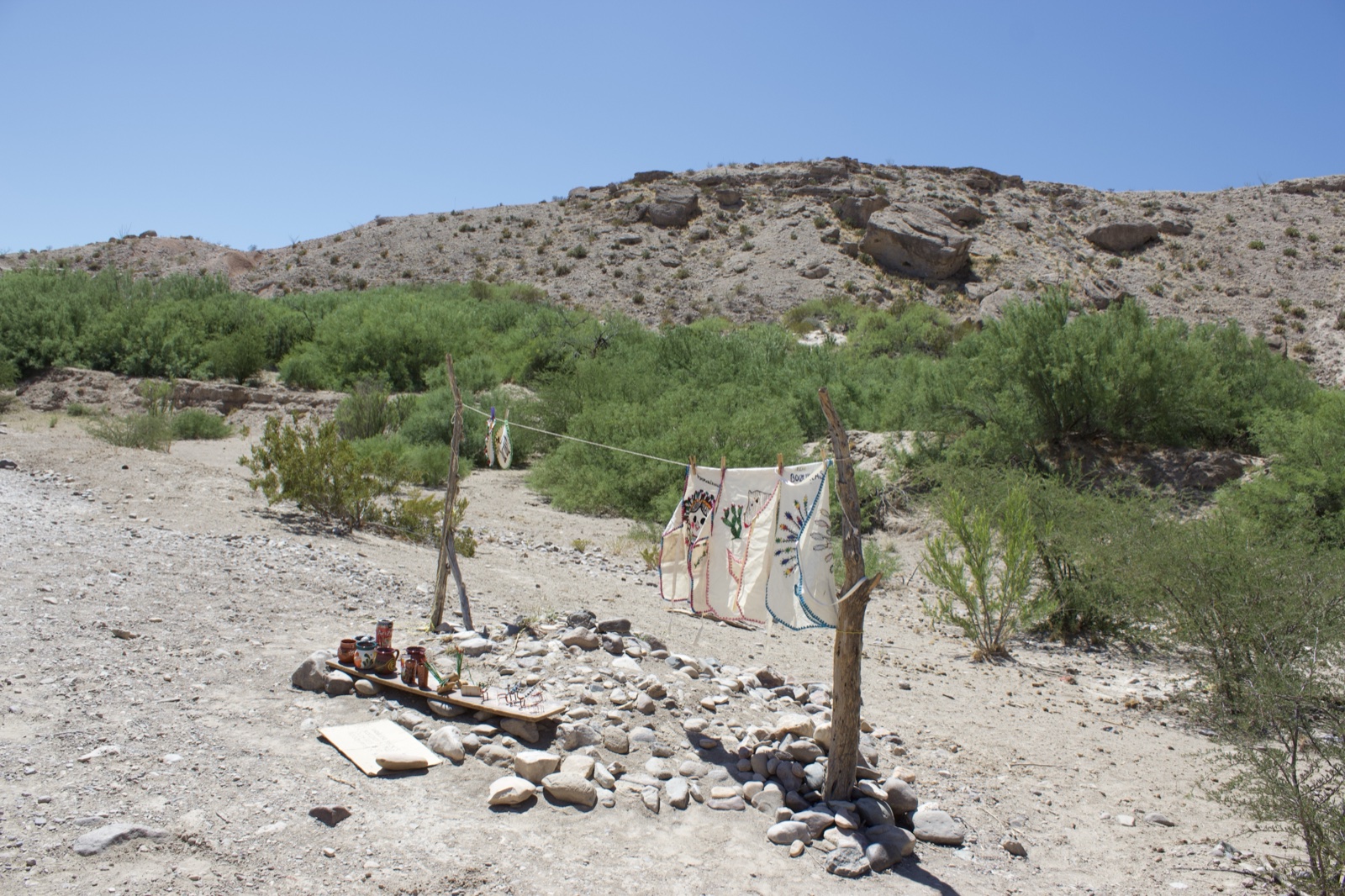 Desert memorial site with painted shields