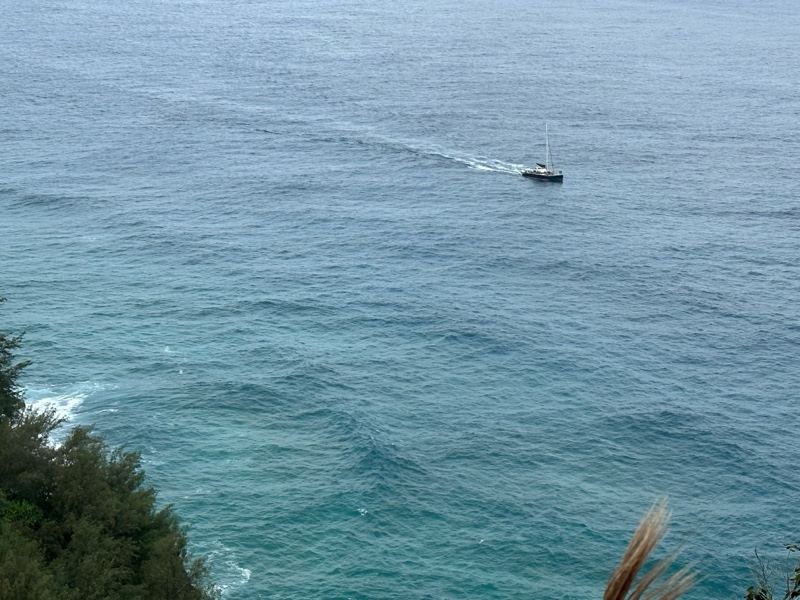 Sailboat on Ocean from Cliff