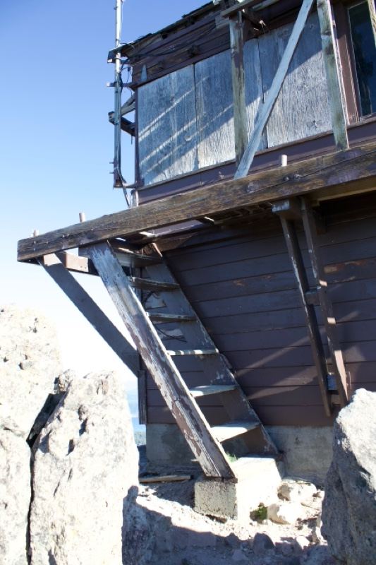 Wooden fire lookout cabin on rocks