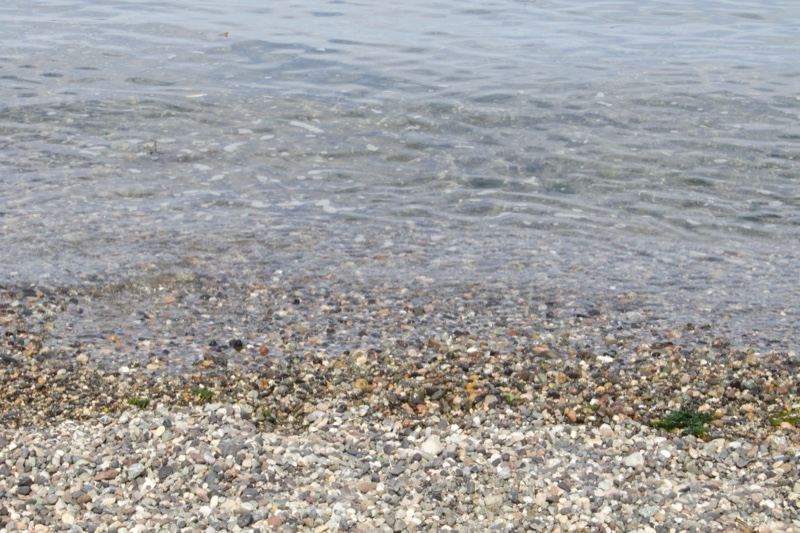 Pebble Shore Meeting Calm Water