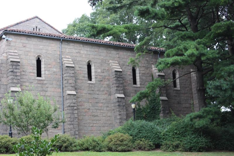 Stone chapel surrounded by trees