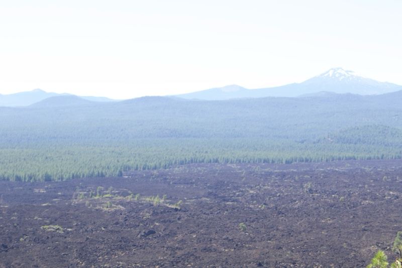 Lava Field With Distant Snow-Capped Mountain