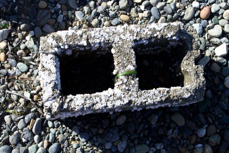 Weathered Cinder Block on Pebbles