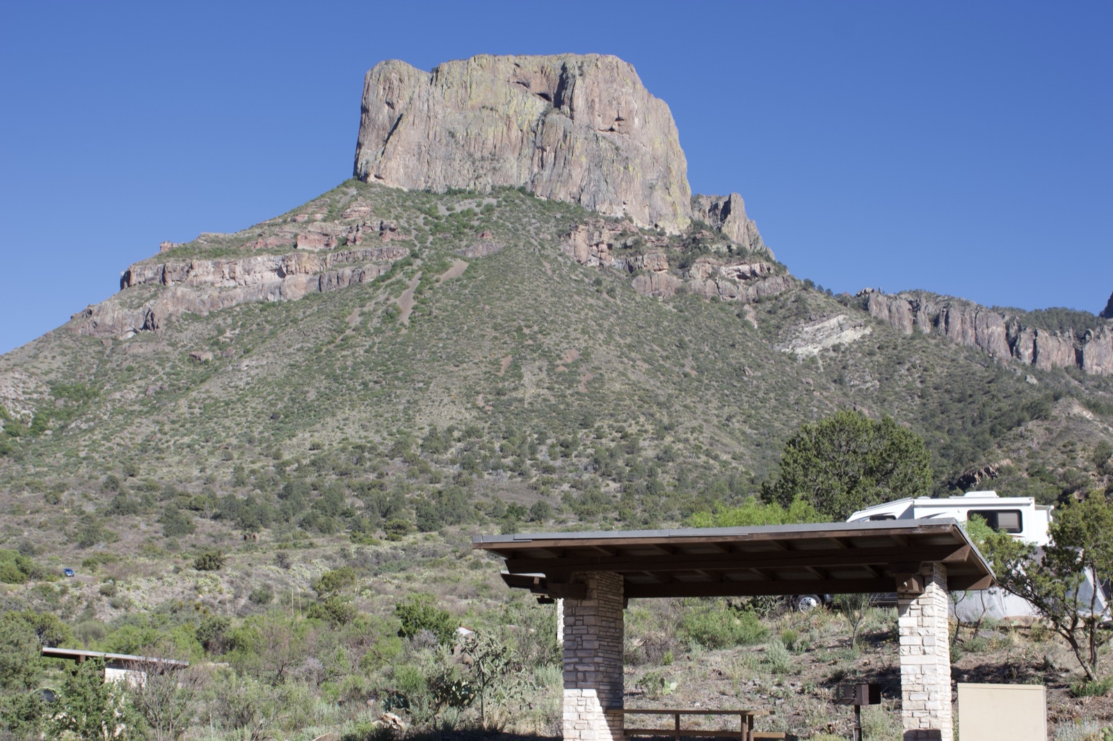Mountain peak over desert campsite
