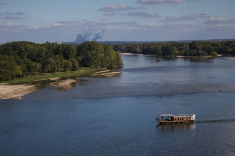 Boat on Wide River Aerial View