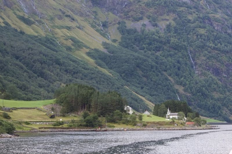 Fjord Valley with Houses Under Mountains