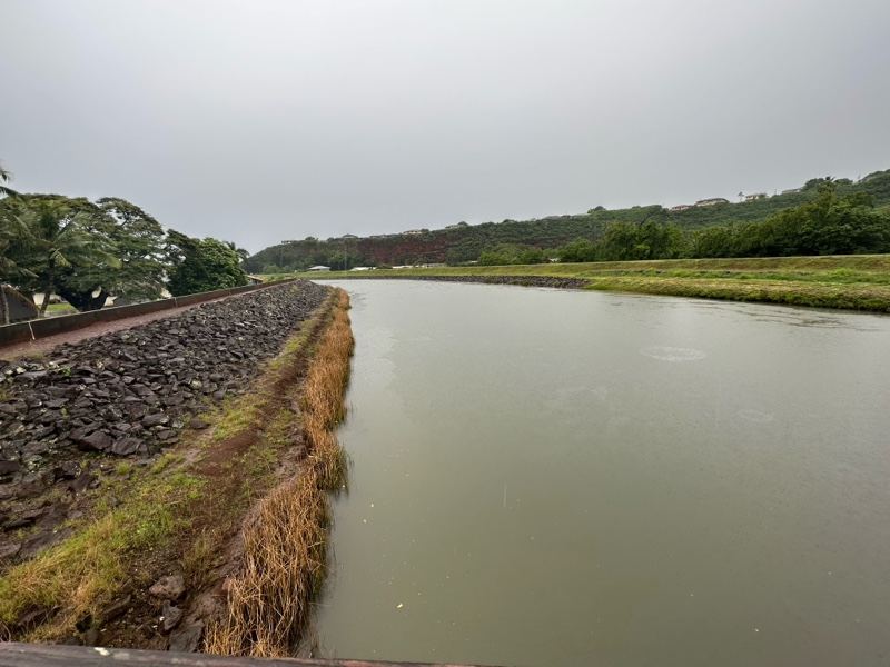Overcast Canal With Rock Embankment