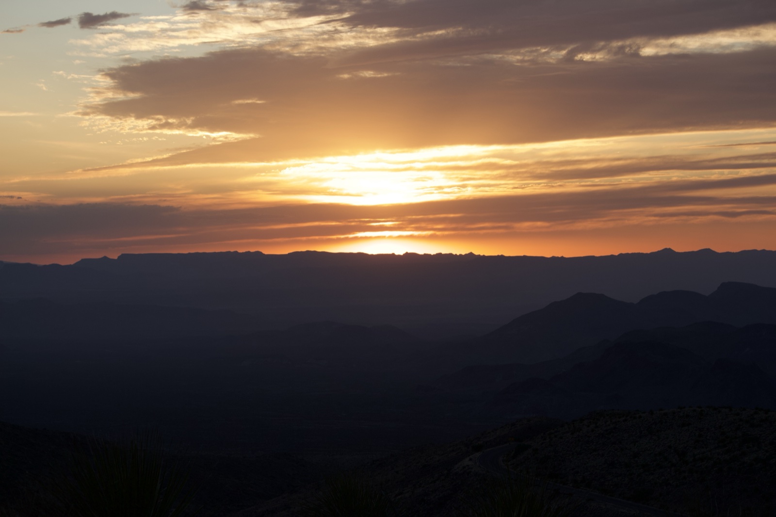 Sunset Over Layered Mountain Ranges