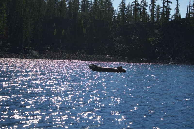 Canoe on Sunlit Lake with Forest