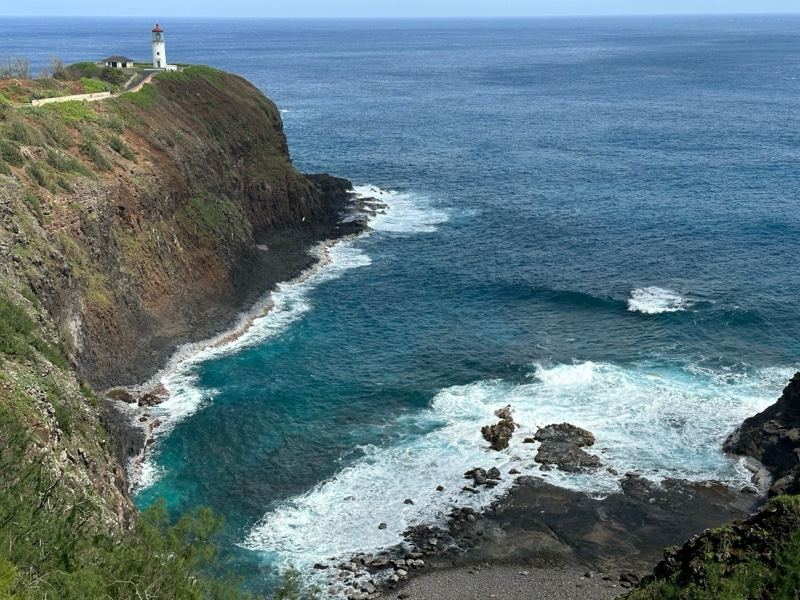 Coastal Lighthouse on Cliff Over Ocean