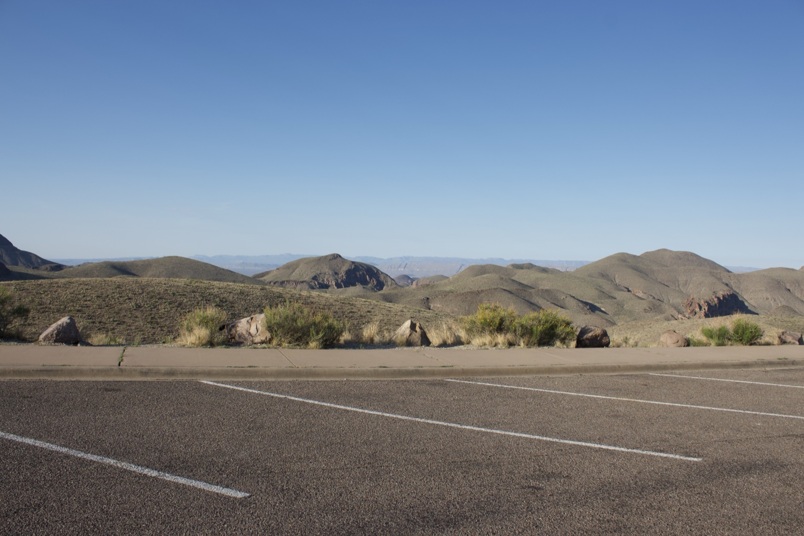 Empty Parking Lot Over Desert Hills