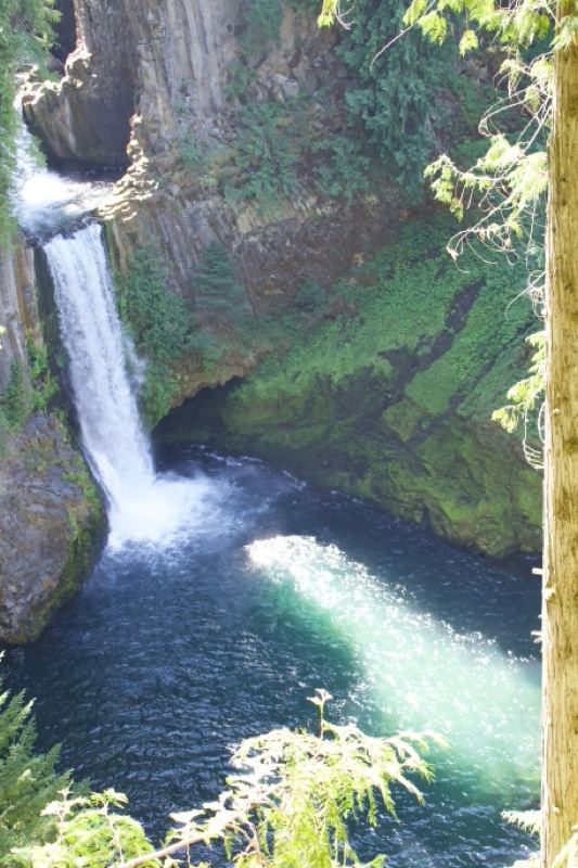 Waterfall Cascading Into Deep Pool